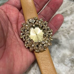 Heidi Daus cream leather band, bejeweled watch.